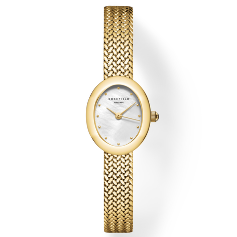 Gold watch with a white face on a light gray background