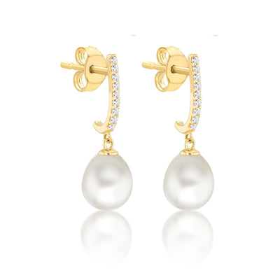 A pair of yellow gold pearl earrings with cubic zirconia accents, featuring a drop earring style with post backs.