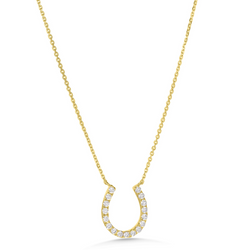 Gold necklace with a horseshoe-shaped pendant on a white background