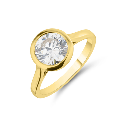 Gold ring with a large diamond on a white background