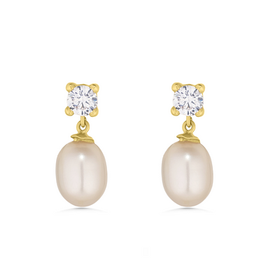 Pair of pearl earrings with gold and clear gemstones on a white background