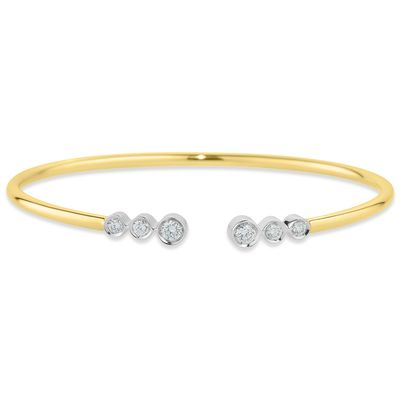 Gold bracelet with small diamonds on a white background