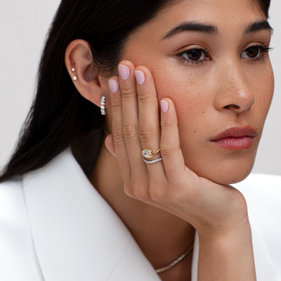 model wearing floating oval diamond ring