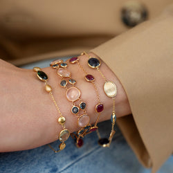 MODEL WEARING COLOUR BRACELET STACK