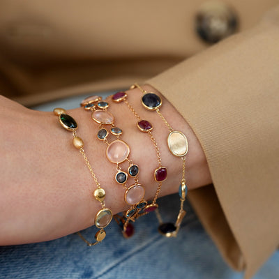 MODEL WEARING COLOUR BRACELET STACK