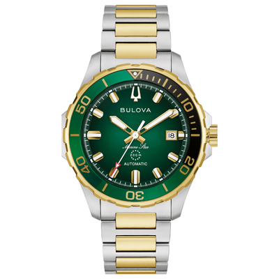 A Bulova Automatic Submariner watch with a green dial, green and black rotating bezel, and a two-tone silver and gold stainless steel link bracelet, shown on a solid white background.