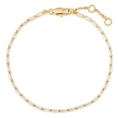 Gold and white beaded bracelet on a white background