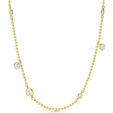 Gold necklace with small diamonds on a white background
