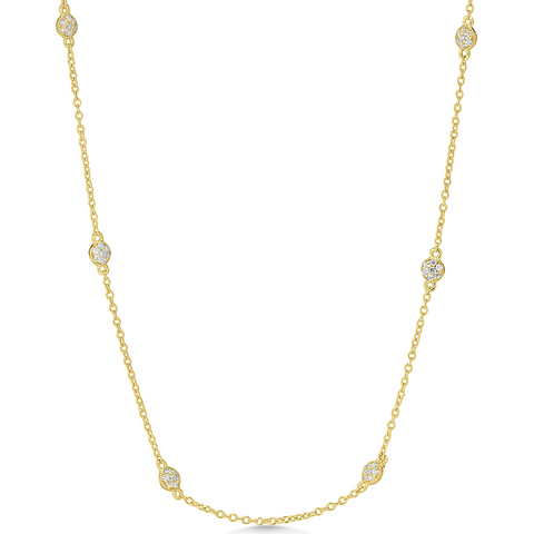 Gold necklace with diamond beads on a white background