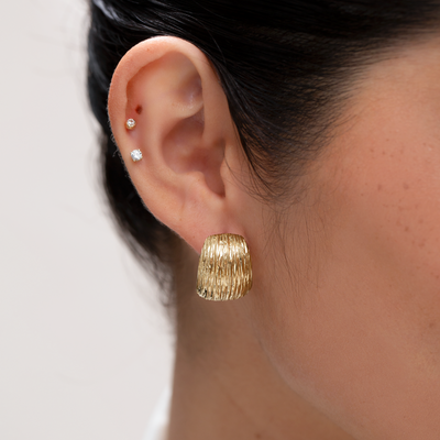 Gold Dome Ridge Oversized Stud Earrings modelled