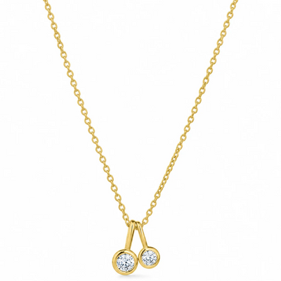 A delicate gold chain necklace with a pendant featuring two small round clear gemstones in gold settings, shown against a plain white background.