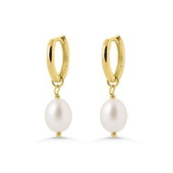 Gold hoop earrings with pearl drops on a white background