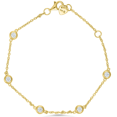 Gold bracelet with diamond accents on a white background