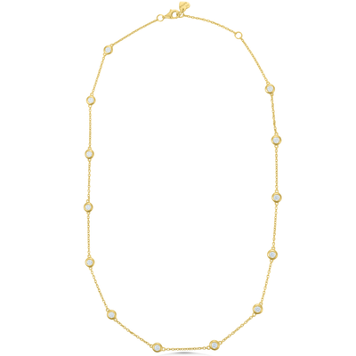 Gold necklace with small diamonds on a white background
