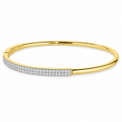 A gold bangle bracelet featuring a row of pavé-set clear stones along the front half, shown on a plain white background.