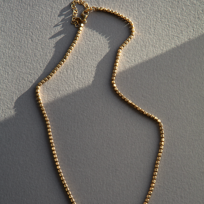 Gold pebble link necklace