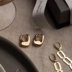 Gold Sculptural Twist Hoops on tablescape