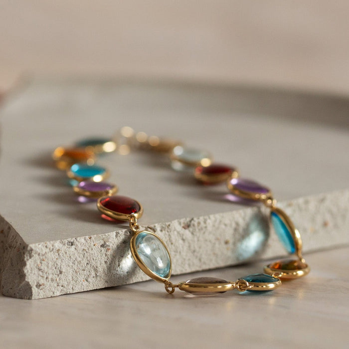 Jewelry set with a ring and bracelet on a neutral background