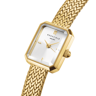 Gold watch with a woven strap on a white background, featuring the brand 'Rosefield'.