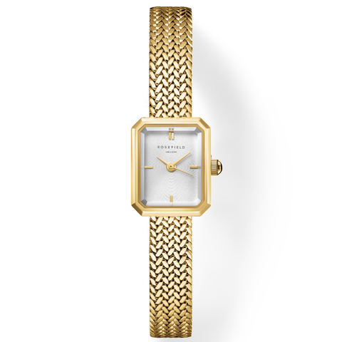 Gold watch with a textured strap on a white background