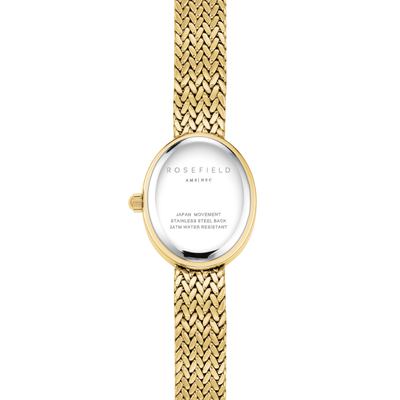 Gold watch with a mesh band on a white background