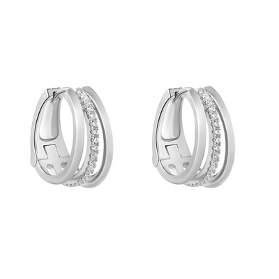 Pair of silver hoop earrings with embedded stones on a white background