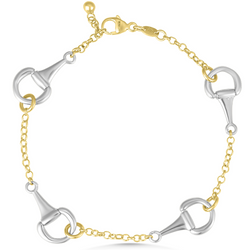 Bracelet with gold and silver horse bit links on a white background
