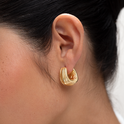 Gold Chunky Ridge Hoop Earrings modelled