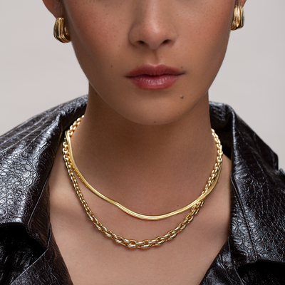 gold necklace stack and matching earrings