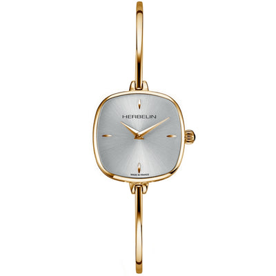 A gold-toned Herbelin Fil bangle watch with a square case, mother-of-pearl dial, and matching gold-toned bracelet.