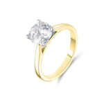 A round brilliant cut lab grown diamond ring in a four claw setting with an 18ct yellow gold band.