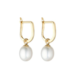 A pair of gold huggie hoop earrings with freshwater pearl drops.