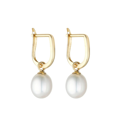 A pair of gold huggie hoop earrings with freshwater pearl drops.